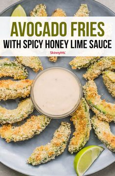 an appetizer with spicy honey lime sauce is on a plate next to some fried vegetables