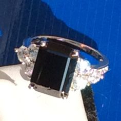 "Luxury 7ct (9*12mm) Emerald Cut Super Sparkling Simulated Created Black  Diamond Engagement Ring in Real Solid 925 Sterling Silver Condition:New Main Stone Color: Black  Main Stone Shape : Emerald Cut Cutting:Excellent Natural/Lab-Created:Lab-Created Sizable:Yes Metal Purity:925 parts per 1000 Brand:Auz Jewellery AUZJ. Hallmark: AUZJ925s Plating: Rhodium Plated Stones Setting: Prong Setting Quality: Super High Quality CZ,  Guarantee: High Quality Stones, Our Silver is NOT Silver Plated or something just \"stamped 925\" but  100% Real Genuine Solid 925 Sterling Silver Seller Notes:\"Top Quality. Special Excellent Cutting. Special Design. Well made. Super High Quality. Solid. 100% 925 Silver. 9*12mm Main Stone. Supper Sparkly. Multi-sizes. Stunning Ring.\" INTERNATIONAL RING SIZE CHART:   R Black Diamond Engagement Ring, Ring Size Chart, Girls Jewelry Box, Black Diamond Engagement, Black Diamond Ring Engagement, Platinum Jewelry, White Gold Wedding Rings, Morganite Ring, Gold Wedding Rings