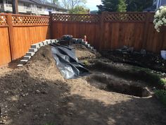 the back yard has been dug up and is ready to be used for landscaping