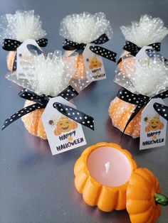 small pumpkins with black and white polka dots on them are sitting next to each other