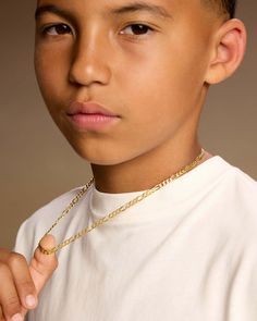 Our youth collection's gold 4mm Figaro Chain is a lightweight and stylish choice for any kid to wear as an everyday chain. This Italian-made chain is crafted with 925 sterling silver and 14k gold for a quality accessory that will withstand a fun and adventurous lifestyle. (Not intended for children twelve & under.) Necklace For Boys For Kids, Chain For Boys, Jewelry For Teens, Necklace For Boys, Adventurous Lifestyle, Birthday Fits, Gold Chain Design, Gold Bond, Solid Gold Chains