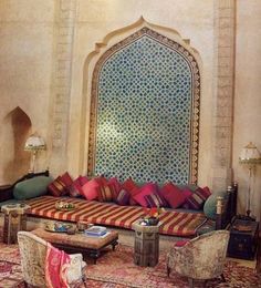 a living room filled with lots of colorful furniture