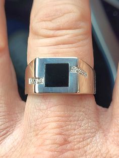 Fresh from estate this spectacular mens or ladies vintage 10k solid white gold classic modern geometric style onyx and diamond signet ring. This vintage ring is spectacular with great quality and probably from the 2000s era. Stamped with 10k purity mark nicely legible. This ring is solid 10k white gold with a spectacular looking genuine square onyx measuring about 7 mm high by 7 mm wide. There are 4 small genuine diamonds on each side of this ring. Ring is a US size 9 1/4- 9 1/2 and weights 3.84 Modern Diamond Jewelry For Formal Occasions, Modern Diamond Signet Ring, Modern Diamond Jewelry With Polished Finish, Formal Diamond Signet Ring With Gemstone, Modern Diamond Signet Ring With Gemstone, Modern Gemstone Signet Ring For Formal Occasions, Modern 14k White Gold Jewelry With Diamond Accents, Modern 14k White Gold Jewelry With Polished Finish, Modern 14k White Gold Jewelry