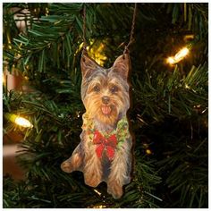 a dog ornament hanging from a christmas tree