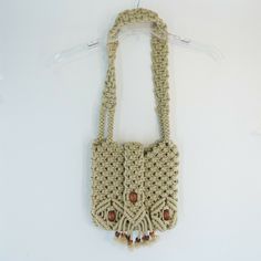 VINTAGE MACRAME SHOULDER BAG. nylon cording. Velcro flap closure. wooden bead accent.   the inside is has a basis I'd pocket. measures about 11 by 10 by 3. 14 inch handle drop. Beige Crochet Shoulder Bag With Macrame, Beige Macrame Crochet Shoulder Bag, Beige Crochet Macrame Shoulder Bag, Bohemian Braided Shoulder Bag, Cream Macrame Shoulder Bag For Daily Use, Beige Rectangular Shoulder Bag With Macrame, Beige Macrame Rectangular Shoulder Bag, Beige Rectangular Macrame Shoulder Bag, Rectangular Beige Macrame Shoulder Bag