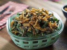 a bowl full of food sitting on top of a table