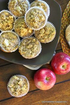 some muffins and apples on a table