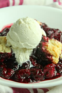 a white bowl filled with fruit and ice cream