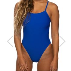 a woman in a blue one piece swimsuit