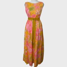 Vintage 1960s To 1970s Malia Honolulu Pink, Yellow And Green Oversized Floral Print Flowy Maxi Dress. 100% Nylon. Labeled A Size 8. Shown On A Size Small Mannequin. Seems Best For An Xs To S. Measurements Below: Chest: 32" Waist: 16.25" Length: 54" Has A Few Small Marks On Fabric (See Closeups), Not Super Obvious Since Fabric Is Flowy. I Did An At Home Dry Cleaning Kit But Did Not Try To Spot Treat. Belt Wraps Around And Attaches On The Underside Of The Bow. You May Want To Add A Snap To The Bac Flowy Floral Maxi Dress, Dry Cleaning At Home, Pink Flower Dress, Small Mannequin, Pink Green Yellow, Flowy Maxi Dress, Yellow And Green, Cleaning Kit, Dress 100