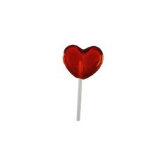 a heart shaped lollipop sitting on top of a stick