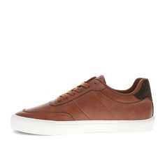 Classic, crisp, and comfortable – these retro-inspired, lowtop sneakers are built to always have your best foot forward. Whether you're meeting the fam for lunch or heading in for a casual day at the office, these men’s sneakers are designed to seamlessly complement any look, from jeans to slacks. The bold rubber outsole adds traction and support while keeping your look polished and crisp. The synthetic leather materials, detailed stitching, and Levi’s iconic red tab logo elevate any outfit with Urban Brown Low-top Skate Shoes, Brown Low-top Urban Skate Shoes, Brown Lace-up Skate Shoes With Gum Sole, Levi's Synthetic Low-top Sneakers, Classic Leather Skate Shoes With Vulcanized Sole, Levi's Casual Low-top Sneakers, Levi's Low-top Sneakers With Rubber Sole, Classic Brown Sneakers With Gum Sole, Urban Brown Skate Shoes With Rubber Sole