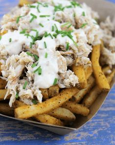 a close up of a plate of food with french fries and cole slaw on it