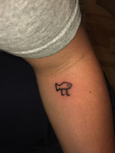 a person with a tattoo on their arm