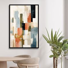 an abstract painting hangs on the wall above a dining room table with chairs and a potted plant