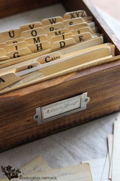 a wooden box filled with lots of letters