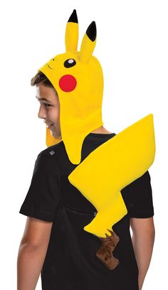 a young boy wearing a pikachu costume