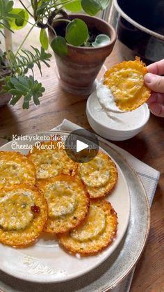 someone is holding up some food on a plate