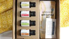 an open box containing five different types of essential oils