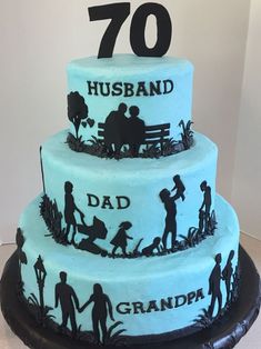 a blue cake with black silhouettes and the number 70 on it