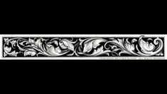 a black and white photo of an ornate border with flowers on the edge, in front of a black background