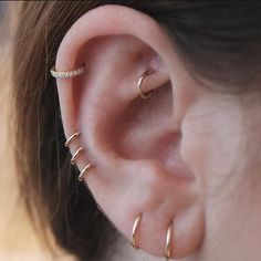 a woman with ear piercings on her ears and the caption reads,'congratulations looks just cool with hoops as studs we did three hops to build space between