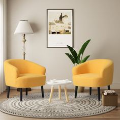 two yellow chairs sitting next to each other on top of a rug in a living room