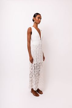 Introducing the stunning Lin White Crochet Maxi Dress! Featuring delicate crochet lace and a deep V front bodice, this dress is sure to make a statement. The modesty lining ensures comfort and coverage, while the rear neck ties add an extra touch of elegance. Don't miss out on this must-have piece for your wardrobe! 100% Cotton. Hand wash. Fitted V-neck Crochet Dress With Lace Trim, Chic Beach Dress With Lace Bodice, Fitted V-neck Crochet Lace Dress, Delicate Lace V-neck Dress For Brunch, Elegant Maxi Dress With Crochet Trim, Chic Lace Maxi Dress With Crochet Trim, White Maxi Dress With Scalloped Lace V-neck, Scalloped Lace V-neck Dress For Brunch, Scalloped Lace V-neck Maxi Dress