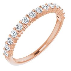 a rose gold wedding band with six diamonds