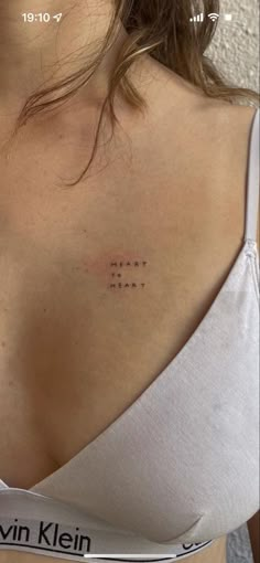 the back of a woman's shoulder with an inscription on it