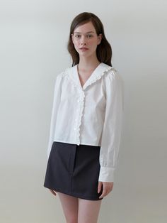 This is a trendy and casual top by KINDABABY that is made out of high quality and sturdy fabric. With unique design detail and feminine mood, you can style it for your casual and young daily outfit.- Shirring on the shoulder- Frill detail from collar to front- V neckline detail- One line button closing Chic Long Sleeve Cotton Blouse, Feminine Cotton V-neck Blouse, Feminine Cotton Long Sleeve Blouse, Chic Collared Cotton Tops, Chic Cotton Collared Tops, Chic Cotton Collared Shirt, Chic Cotton Blouse For Office, Trendy Cotton Blouse For Office, White Cotton Collared Blouse