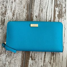 Brand New With Tags Classic Blue Clutch For Travel, Classic Blue Travel Clutch, Elegant Blue Wallets With Interior Card Slots, Chic Kate Spade Wallet For Travel, Chic Kate Spade Wallets For Travel, Chic Kate Spade Travel Wallets, Classic Blue Bags With Card Slots, Blue Rfid Blocking Bags, Elegant Blue Clutch With Zipper Closure