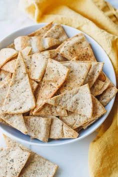 a white plate filled with crackers on top of a table