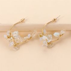 Frame your face with the sparkling elegance of this pair of flower drop earrings made with clear resin and an 18k gold plating. 1.46'' W x 1.46'' L 18k gold-plated copper / resin Gold Flower-shaped Crystal Earrings, Gold Crystal Flower Earrings For Party, Trendy Gold Crystal Earrings For Wedding, Gold Crystal Flower Earrings, Elegant Clear Flower Shaped Earrings, Flower Drop Earrings, Flower Plates, Clear Resin, Gold Plating