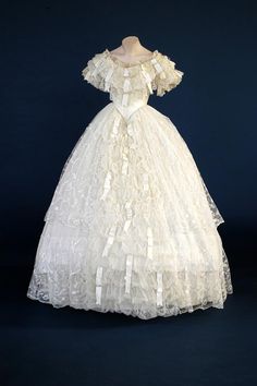 Wedding Dress: 1860 (made, adapted in 1949), English, satin, Limerick lace, hand-embroidered machine net. Limerick Lace, Gaun Abad Pertengahan, Victorian Wedding, Old Dresses, Victorian Clothing, Antique Dress, Vintage Gowns