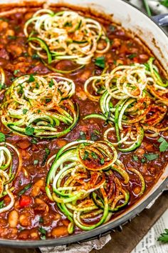 a pan filled with zucchini and bean stew