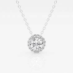 A diamond with a fine halo is better than none! This beautiful round lab grown diamond pendant is encircled with tiny shimmering smaller diamonds, to Luxury Diamond Necklace With Round Pendant And Cable Chain, Round Lab Grown Diamond Necklace With Halo Setting, Round Halo Setting Necklace With Lab Grown Diamond, Diamond White Necklace With Halo Setting And Round Stone, Round Necklace With Halo Setting And Lab Grown Diamond, Sterling Silver Diamond White Necklace With Halo Design, White Diamond Necklace With Round Cut Halo Design, Dazzling Solitaire Necklace With Round Pendant And Halo Setting, Dazzling Cubic Zirconia Diamond Necklace With Halo Design