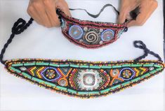 Discover the essence of Moroccan craftsmanship with our Handmade Beaded Traditional Moroccan Belt, a stunning accessory designed to make Amazigh women bloom and shine like a flower. These belts are perfect for traditional events like the Ahwash dance, combining rich cultural heritage with intricate artistry.   Our Story and Craft Hand beading is a timeless tradition passed down through generations in Morocco. Each belt is a labor of love, crafted by skilled artisans who meticulously stitch each Traditional Embroidered Beaded Necklaces For Festivals, Traditional Multicolor Beaded Necklaces For Ceremonies, Traditional Multicolor Beaded Bracelets For Festival, Traditional Festival Beaded Necklaces, Traditional Beaded Necklaces With Colorful Beads For Festival, Traditional Beaded Necklace For Festivals, Adjustable Traditional Beaded Necklaces For Festivals, Traditional Adjustable Beaded Bracelets For Festivals, Traditional Handmade Ceremonial Beads