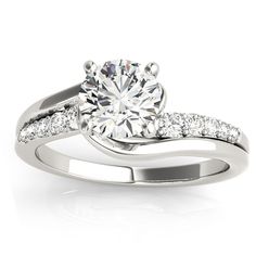 a white gold engagement ring with diamonds on it