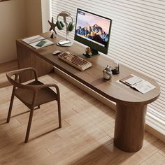 a desk with a computer monitor, keyboard and headphones sitting on top of it