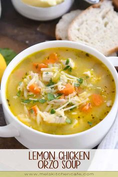 a bowl of lemon chicken orzo soup with bread in the background