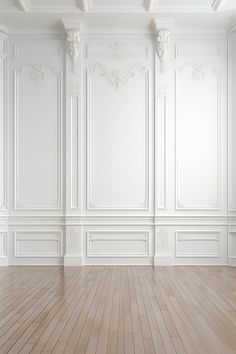 an empty room with white walls and wooden floors