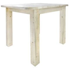 a white wooden table sitting on top of a white floor