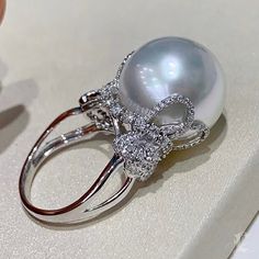 Luxury Oval Rings With Pearl Drop, Luxury Vintage Pearl Ring For Women, Luxury Elegant Pearl Ring With Round Band, Luxury Elegant Pearl Ring, Luxury Vintage Pearl Ring For Formal Events, Luxury Pearl Ring With Round Cut Center Stone, Luxury Classic Platinum Pearl Ring, Luxury Fine Jewelry Pearl Ring With Round Band, Luxury Pear-shaped Pearl Ring For Formal Occasions