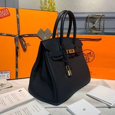 Description HRMS Birkin 30 Togo Black Bag For Women, Women’s Handbags 11.8in/30cm Rep 1:1 In 1984, somewhere above the English Channel on an Air France flight from Paris to London, the idea of the Birkin bag was born. As actress Jane Birkin star of ‘Wonderwall’ and ‘Blowup’ stuffed her trademark wicker basket bag into the overhead compartment, the contents spilled out onto the seat and aisle below. 30 x 22 x 16 cm / 11.8 x 8.6 x 6.3 inches (Length x Height x Width) Double rolled handles Gold-ton Black Handheld Bag With Dust Bag Included, Large Elegant Black Bag, Elegant Large Black Bag, Large Satchel With Dust Bag For Daily Use, Black Rectangular Satchel With Dust Bag, Black Rectangular Satchel With Dust Bag Included, Large Black Luxury Bag, Large Luxury Black Bag, Elegant Large Black Shoulder Bag