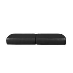 a black ottoman with two seats on it and one seat cushion is facing the opposite direction