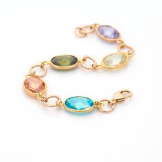 "READY TO SHIP ✈ Colorful Gemstones Bracelet, women Gold filled Bracelet, beautiful Boho chic Bracelet. This bracelet is a perfect birthday gift for your love / mom / girlfriend / granddaughter or just for yourself. Features: * Handmade * Gold filled * Bracelet length is about: 7.5\" (19 cm) - Can be customized to fit you perfectly! Please send me a message with your size. See more Bracelets in my shop - http://etsy.me/2sZGhZe See more Birthstone Jewelry in my shop - http://etsy.me/2FDHOXh See m Spiritual Birthstone Crystal Bracelet, Elegant Multicolor Birthstone Bracelets, Elegant Multicolor Birthstone Bracelet, Birthstone Bracelets For Jewelry Making, Multicolor Oval Bracelets With Natural Stones, Multicolor Faceted Crystal Bracelet As Gift, Bracelet Women Gold, Bracelet For Mom, Boho Chic Bracelets