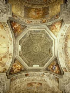 an ornate ceiling with paintings on it