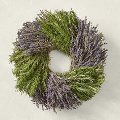 a wreath made out of lavender and green grass