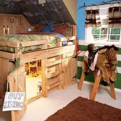 a child's bedroom with a loft bed and horse toys on the floor in front of it